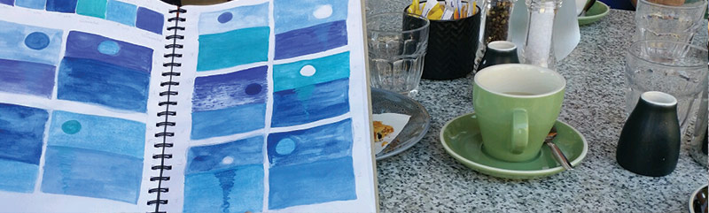 Thumbnail sketch paintings by Amanda with tea on the side